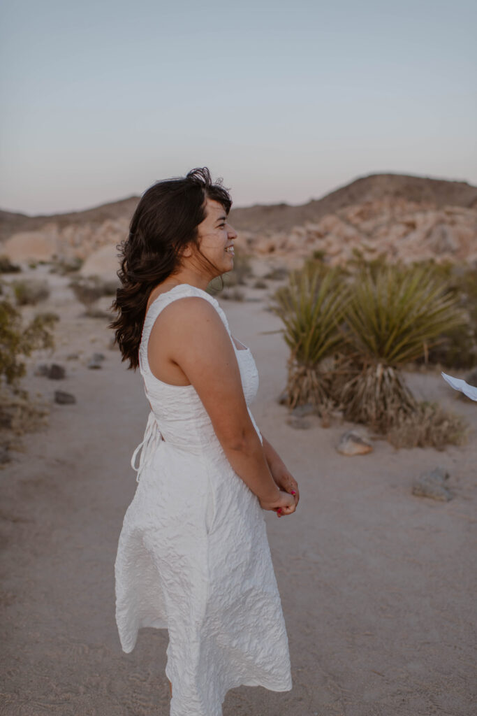 “Couple exchanging vows at sunset in Joshua Tree National Park”
“Intimate desert vow reading at golden hour”