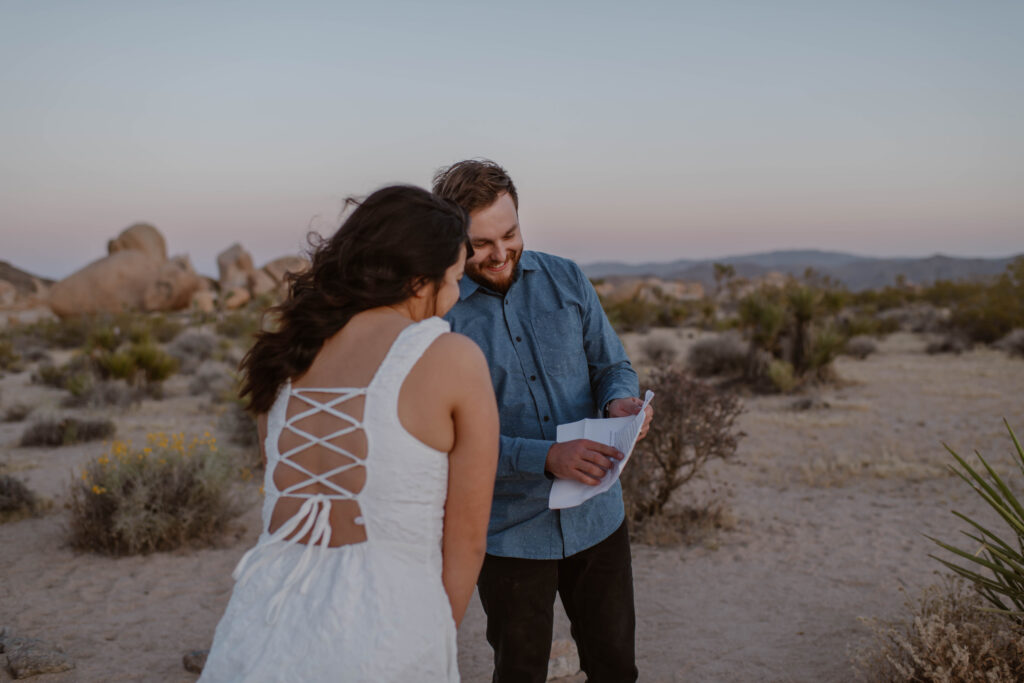 “Couple exchanging vows at sunset in Joshua Tree National Park”
“Intimate desert vow reading at golden hour”