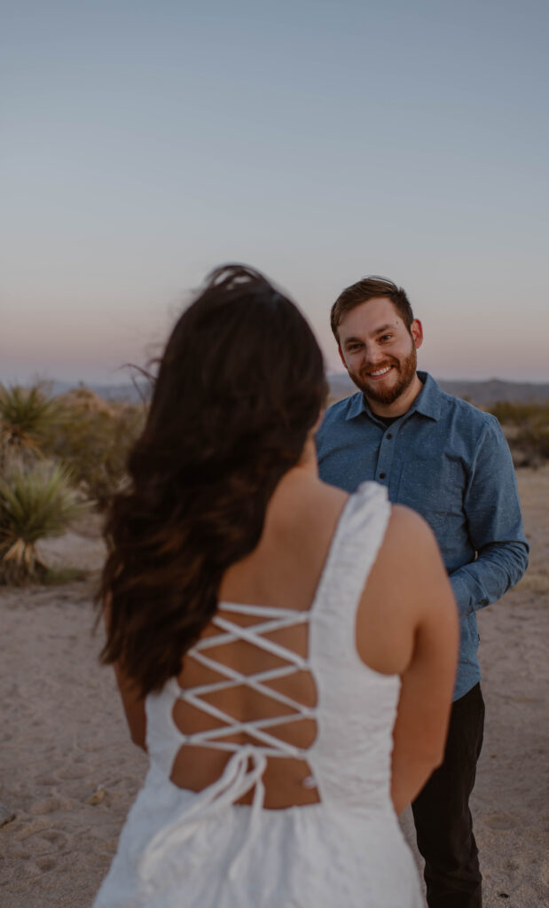 “Couple exchanging vows at sunset in Joshua Tree National Park”
“Intimate desert vow reading at golden hour”