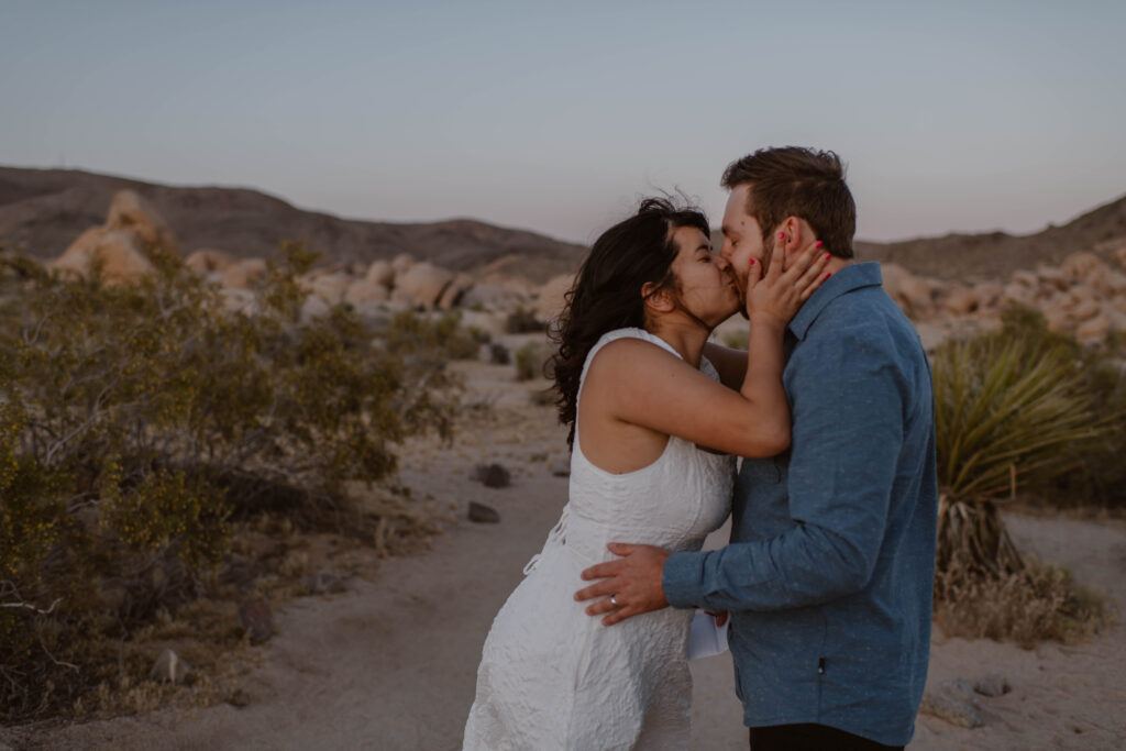 “Couple exchanging vows at sunset in Joshua Tree National Park”
“Intimate desert vow reading at golden hour”