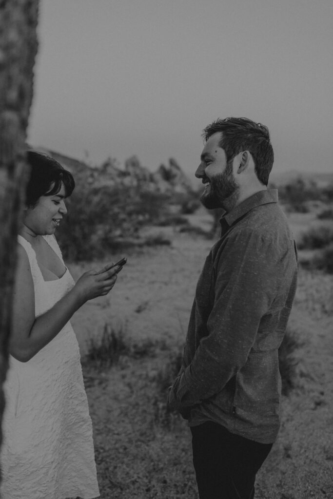 “Couple exchanging vows at sunset in Joshua Tree National Park”
“Intimate desert vow reading at golden hour”